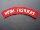 THE ROYAL FUSILIERS CLOTH SHOULDER TITLE