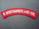 ROYAL NORTHUMBERLAND FUSILIERS CLOTH SHOULDER TITLE